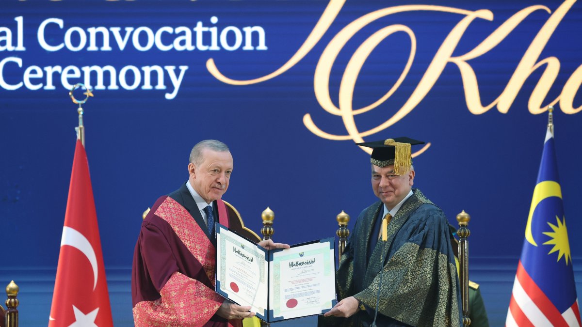 President Recep Tayyip Erdoğan receives an honorary doctorate title from Sultan of Perak Nazrin Shah, Kuala Lumpur, Malaysia, Feb. 10, 2025. (AA Photo)