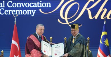 President Recep Tayyip Erdoğan receives an honorary doctorate title from Sultan of Perak Nazrin Shah, Kuala Lumpur, Malaysia, Feb. 10, 2025. (AA Photo)