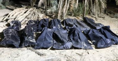Bodies of migrants lie in bags after they were discovered in a mass grave on a farm in Jikharra, Libya, Feb. 5, 2025. (Reuters Photo)