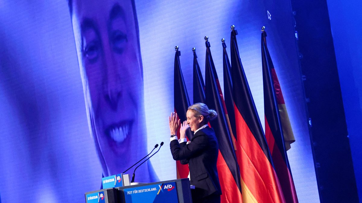 Alice Weidel, co-leader of the Alternative for Germany party (AfD), gestures as SpaceX CEO Elon Musk appears on the screen during a central election campaign event of the AfD, Halle (Saale), Germany, Jan. 25, 2025. (Reuters Photo)