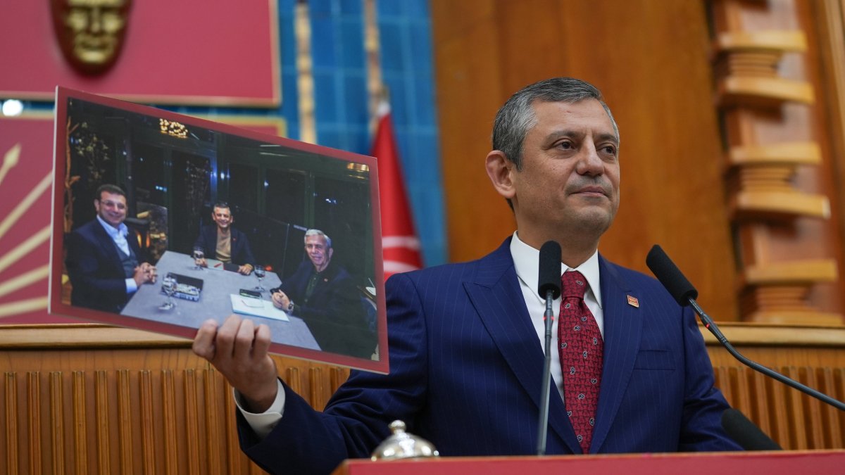 Republican People’s Party (CHP) Chair Özgür Özel holds a photo of himself, Istanbul Mayor Ekrem Imamoğlu and Ankara Mayor Mansur Yavaş, as he speaks at a parliamentary meeting of his party, Ankara, Türkiye, Feb. 11, 2025. (AA Photo) 