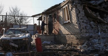 A woman closes the door of her house hit by a Russian airstrike, in the town of Kostiantynivka, Donetsk region, Ukraine, Feb. 9, 2025. (Reuters Photo)