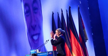 Alice Weidel, co-leader of the Alternative for Germany party (AfD), gestures as SpaceX CEO Elon Musk appears on the screen during a central election campaign event of the AfD, Halle (Saale), Germany, Jan. 25, 2025. (Reuters Photo)
