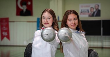Turkish epee fencers Ceren Cebe (L) and Nilahsen Erten pose for a photo after a training session, İzmir, Türkiye, Feb. 4, 2025. (AA Photo)