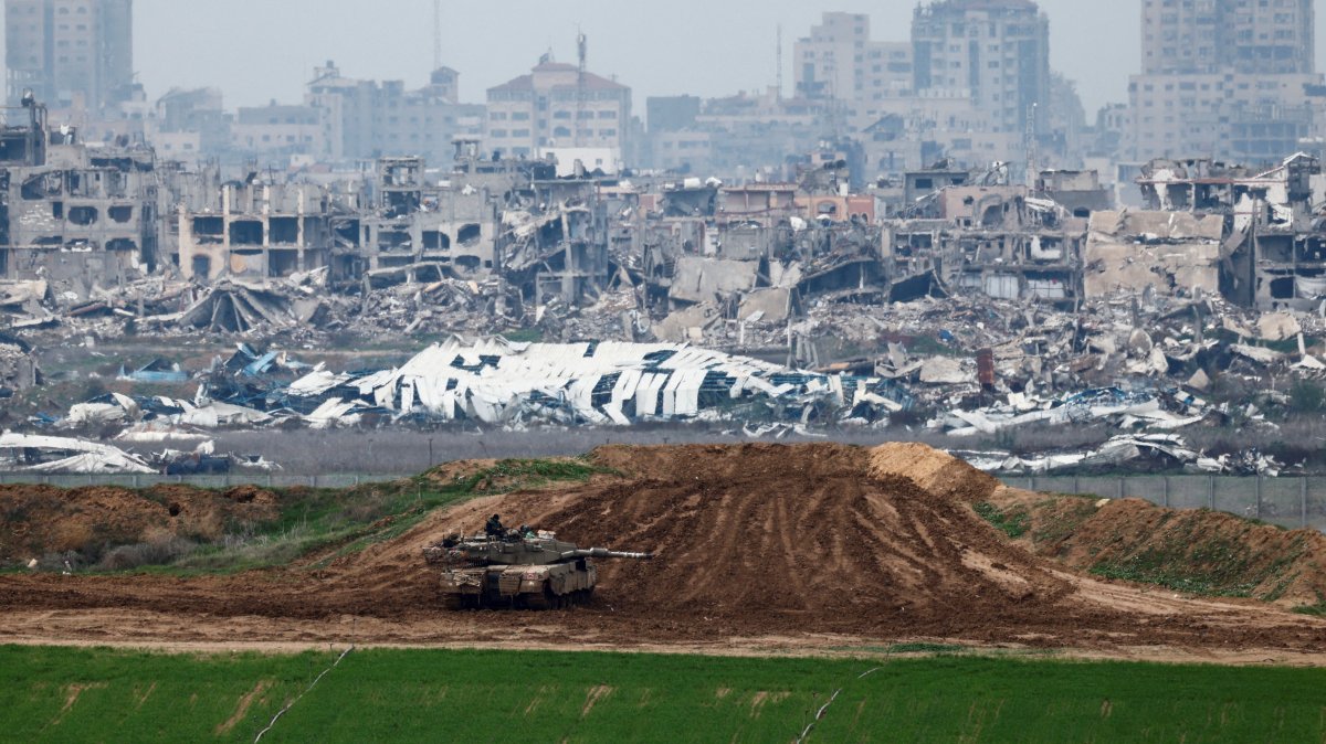 An Israeli soldier sits on a tank as he looks at the destruction, Gaza, Palestine, Feb. 11, 2025. (Reuters Photo)