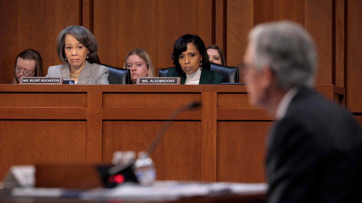 Senate Banking Committee members Sens. Lisa Blunt Rochester (D-DE) (L) and Angela Alsobrooks (D-MD) listen to testimony from Fed Chair Jerome Powell during a committee hearing, Washington, U.S., Feb. 11, 2025. (AFP Photo)
