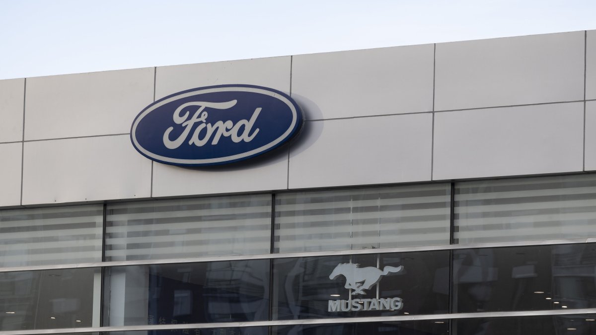 The logos of American car maker Ford and its model Mustang are seen at a car dealership in Beijing, China, Feb. 4, 2025. (EPA Photo)