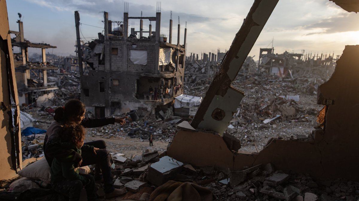 Palestinian youth watch the sunset from their destroyed house in the Jabalia camp, north of Gaza City, Palestine, Feb. 11, 2025. (EPA Photo)