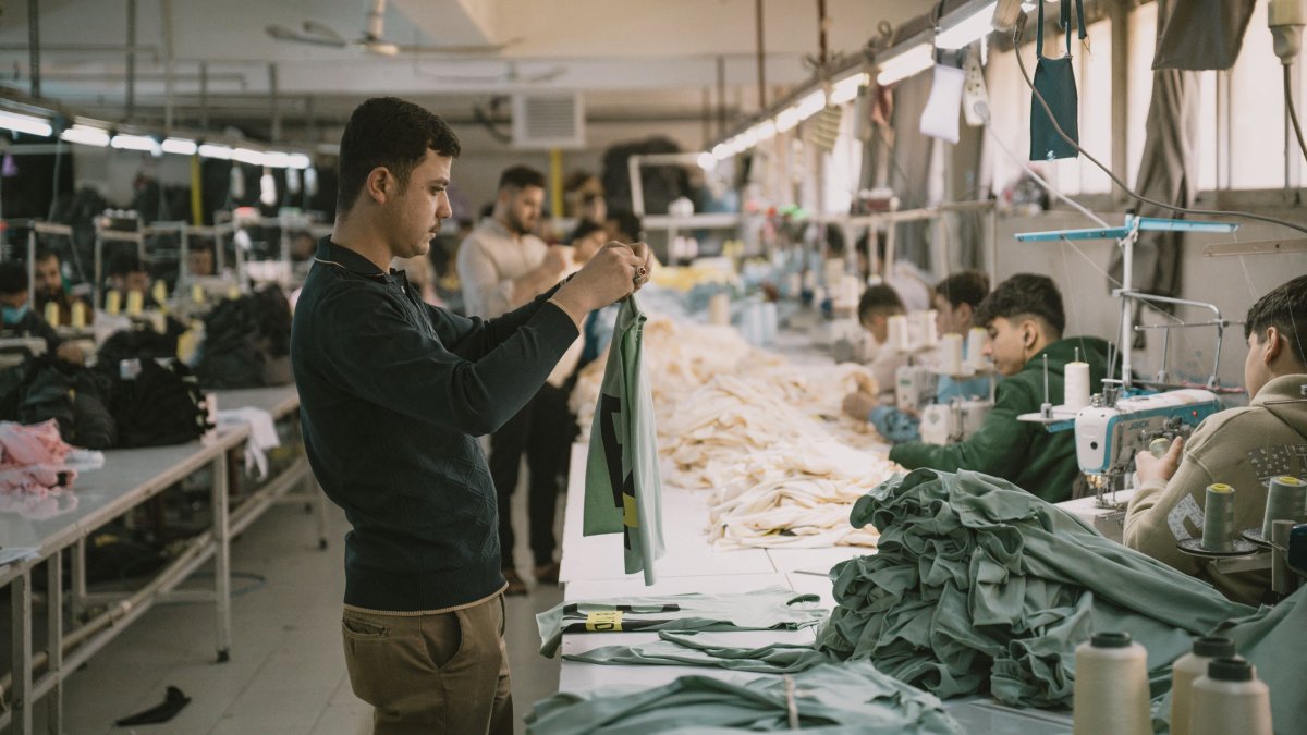 Syrian textile employees work in a textile workshop in Gaziantep, southeastern Türkiye, Jan. 30, 2025. (AFP Photo)