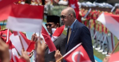 President Recep Tayyip Erdoğan (C), accompanied by Indonesian President Prabowo Subianto (L), inspects honor guards during a welcome ceremony at the Presidential Palace, Bogor, Indonesia, Feb. 12, 2025. (EPA Photo)