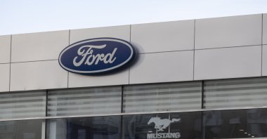 The logos of American car maker Ford and its model Mustang are seen at a car dealership in Beijing, China, Feb. 4, 2025. (EPA Photo)