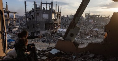 Palestinian youth watch the sunset from their destroyed house in the Jabalia camp, north of Gaza City, Palestine, Feb. 11, 2025. (EPA Photo)