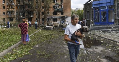 Residents leave an apartment building damaged in shelling by Ukrainian forces in Kursk, Russia, Aug. 11, 2024. (AP Photo)