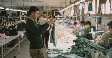 Syrian textile employees work in a textile workshop in Gaziantep, southeastern Türkiye, Jan. 30, 2025. (AFP Photo)