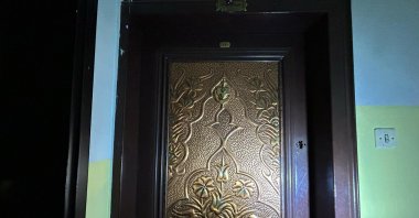 Entrance to the home where the remains of an elderly woman were found, Izmir, Türkiye, Feb. 12, 2025. (IHA Photo)