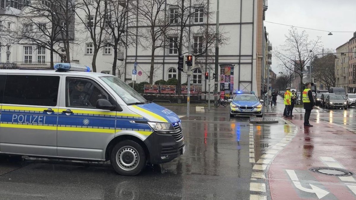 A police car attends the scene of an accident after a driver hit a group of people in Munich, Germany, Thursday Feb. 13, 2025. (Roland Freund/dpa via AP)