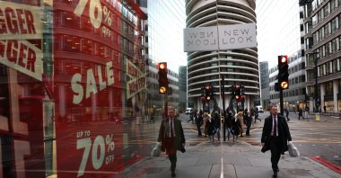 People walk down a street in the financial district of the City of London, London, U.K., Jan. 27, 2025. (EPA Photo)