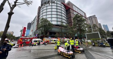 Emergency workers at the scene of a large explosion in Taichung, Taiwan, Feb. 13, 2024. (AFP Photo)