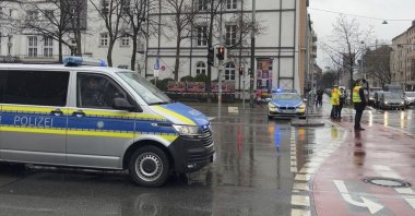 A police car attends the scene of an accident after a driver hit a group of people in Munich, Germany, Thursday Feb. 13, 2025. (Roland Freund/dpa via AP)
