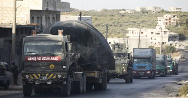 A Turkish military convoy drives through the village of Urum al-Jawz, in Idlib province, Syria, Oct. 20, 2020. (AP Photo)