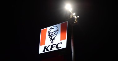 A street lamp illuminates the logo of the American fast-food restaurant chain Kentucky Fried Chicken (KFC),  Aksaray, central Türkiye, Feb. 18, 2024. (Reuters Photo)