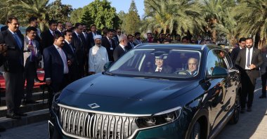 President Recep Tayyip Erdoğan and Pakistani Prime Minister Shahbaz Sharif drive a Togg T10X, Türkiye's domestic electric car, in Islamabad, Pakistan, Feb. 13, 2025. (DHA Photo)