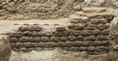 In this photo provided by MOLA, Museum of London Archaeology taken in summer 2024, a view of part of the wall of the Roman London Basilica which has been recently unearthed by a redevelopment of a City of London building in London. (MOLA via AP)