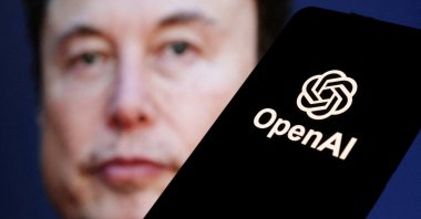 The OpenAI logo is seen in front of Elon Musk&#039;s photo in this illustration taken March 11, 2024. (Reuters Photo)