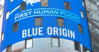 Blue Origin signage is displayed on a screen before the launch of Jeff Bezos and his three crewmates on Blue Origin&#039;s inaugural flight to the edge of space, in Times Square in New York City, U.S., July 20, 2021. (Reuters Photo)