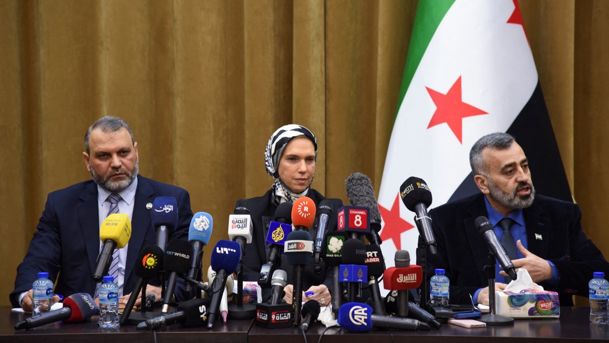 Mustafa al-Moussa (L), who served in the HTS-affiliated government of the northwest, Houda Atassi (C), co-founder of International Humanitarian Relief, an NGO and Hassan al-Dughaim, the spokesperson for the preparatory committee of national dialogue, attend a news conference, Damascus, Syria, Feb. 13, 2025. (Reuters Photo)