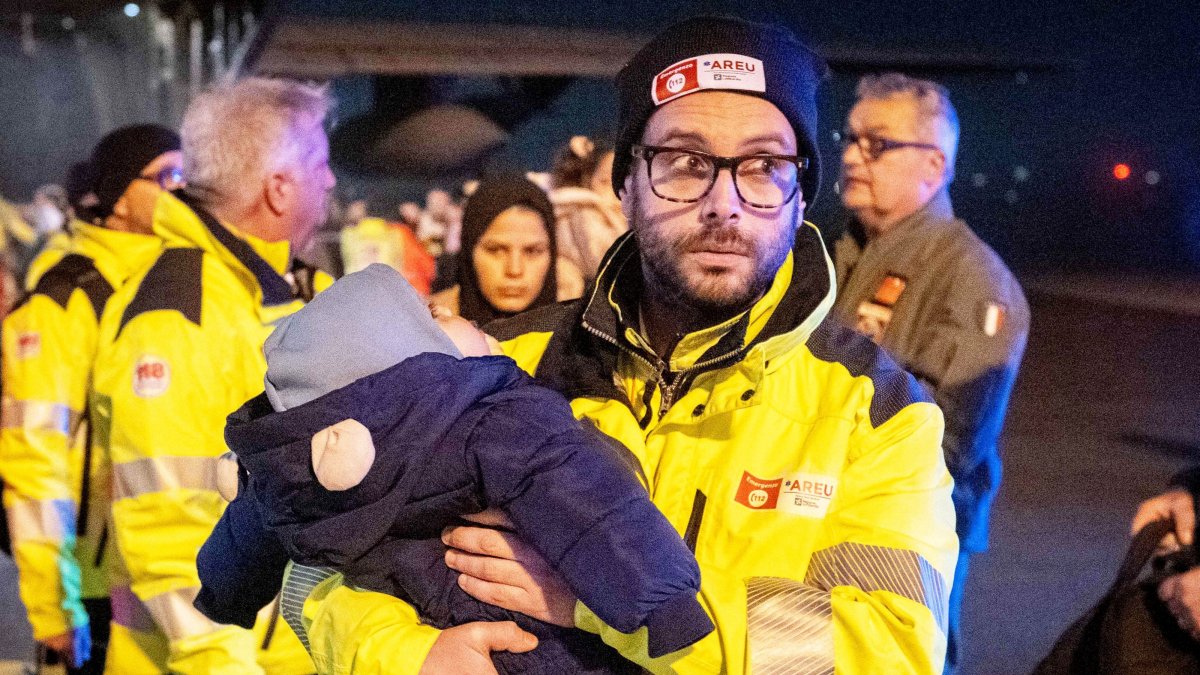 Rescuers and authorities carry children from Gaza in need of care at Linate airport, Milan, Italy, Feb. 14, 2025. (EPA Photo)