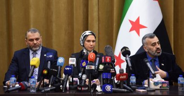 Mustafa al-Moussa (L), who served in the HTS-affiliated government of the northwest, Houda Atassi (C), co-founder of International Humanitarian Relief, an NGO and Hassan al-Dughaim, the spokesperson for the preparatory committee of national dialogue, attend a news conference, Damascus, Syria, Feb. 13, 2025. (Reuters Photo)
