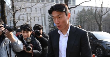 South Korean footballer Hwang Ui-jo leaves after receiving a sentence over his sex-video scandal at the Seoul Central District Court, Seoul, South Korea, Feb. 14, 2025. (AFP Photo)