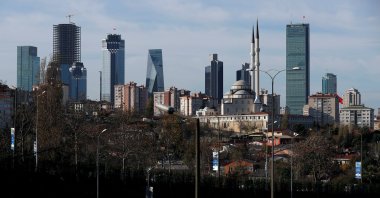 Business and financial district of Levent, which comprises of leading Turkish banks and companies&#039; headquarters, is seen behind a residential neighborhood in Istanbul, Türkiye, Nov. 30, 2017. (Reuters Photo)