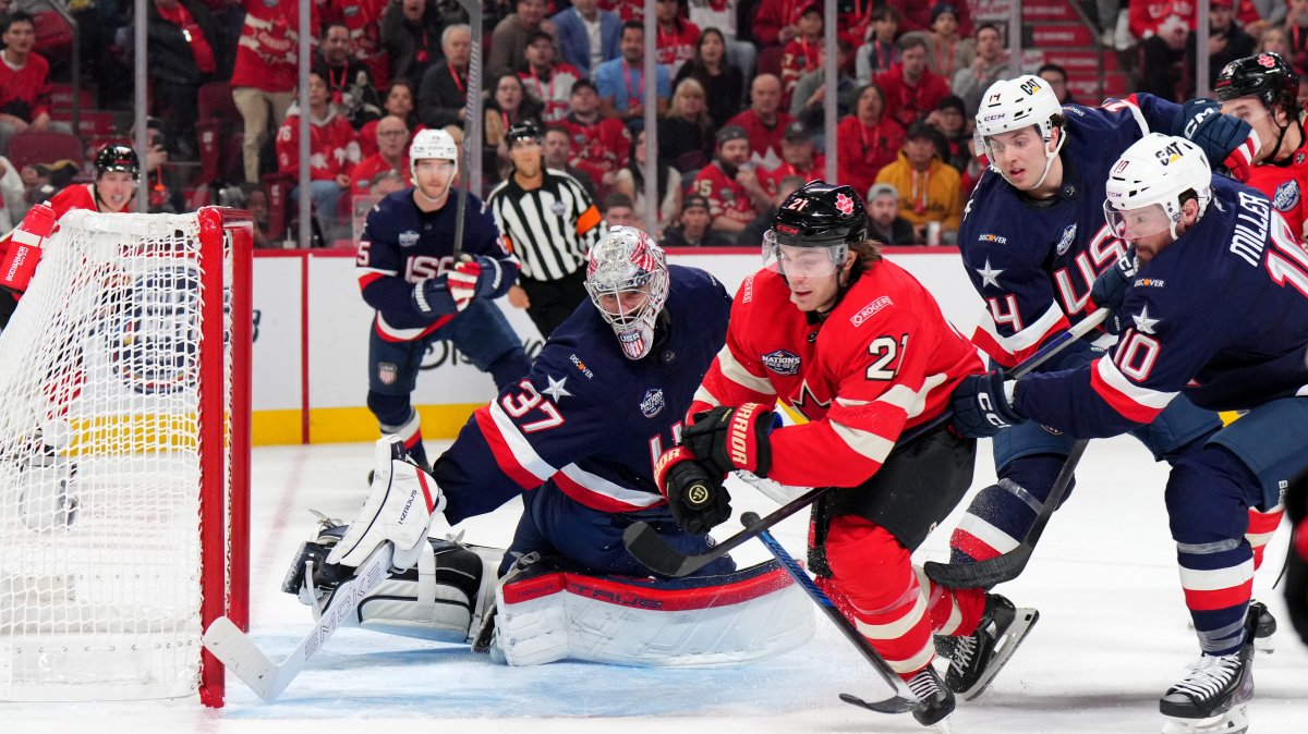 Team Canada and Team USA players vie for a loose puck during a 4 Nations Face-Off game in Montreal, Quebec, Canada, Feb. 15, 2025. (Getty Images)