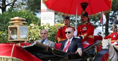 President Recep Tayyip Erdoğan goes to the official dinner given in his honor by Pakistani President Asif Ali Zardari in a rickshaw during his visit to Pakistan, Islamabad, Pakistan, Feb. 13, 2025. (İHA Photo)