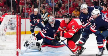 Team Canada and Team USA players vie for a loose puck during a 4 Nations Face-Off game in Montreal, Quebec, Canada, Feb. 15, 2025. (Getty Images)