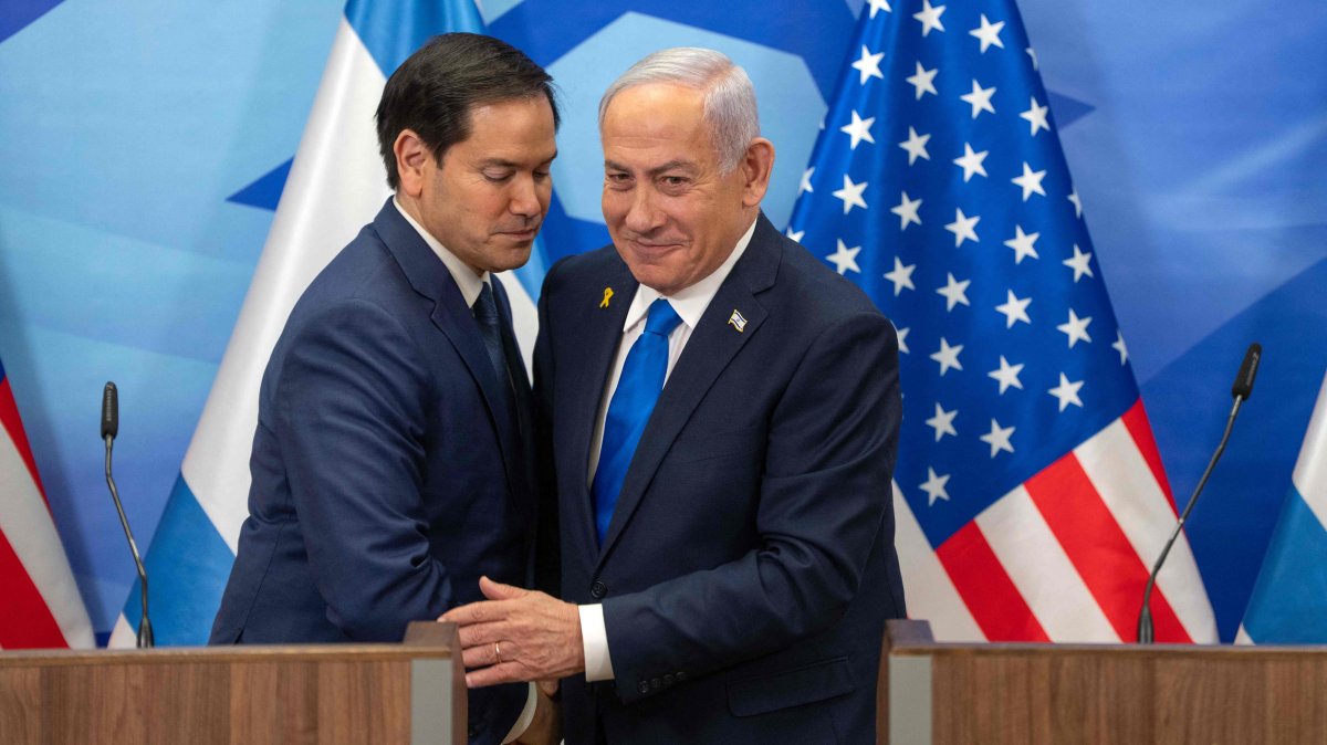 U.S. Secretary of State Marco Rubio (L) and Israeli Prime Minister Benjamin Netanyahu greet each other during a joint press conference in west Jerusalem, Israel, Feb. 16, 2025. (AFP Photo)
