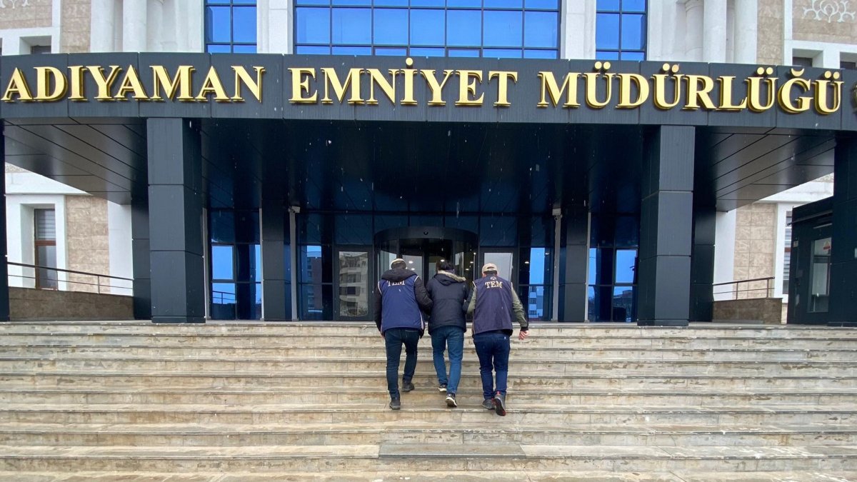 Police escort to the station a fugitive judge convicted of links to FETÖ, eastern Adıyaman province, Türkiye, Feb. 10, 2025. (AA Photo)