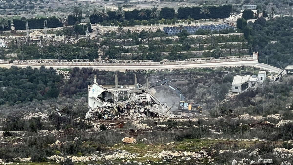 An excavator works on the Lebanese side of the border between Israel and Lebanon, as seen from Israel, Feb.17, 2025. (Reuters Photo)