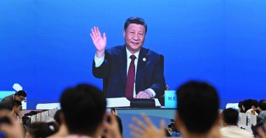 A screen at a media center shows China&#039;s President Xi Jinping attending the opening ceremony of the Harbin 2025 Asian Winter Games, Harbin, Heilongjiang province, China, Jan. 7, 2025. (AFP Photo)
