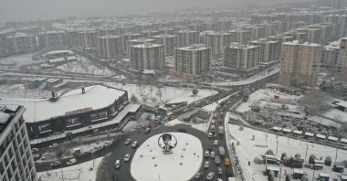 Snow-covered buildings in Beylikdüzü as the municipality conducts snow removal efforts, Istanbul, Türkiye, Feb. 11, 2025. (IHA Photo)