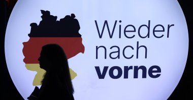 A person passes the slogan &quot;Forward again&quot; during a Christian Democratic Union (CDU) party election campaign event, Sankt Ingbert, Germany, Feb. 6, 2025. (EPA Photo)