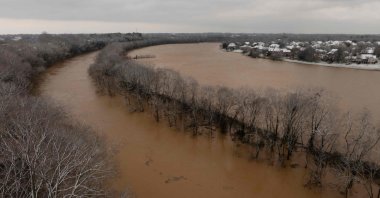 This aerial view shows the Barren River floods after a rain storm in Bowling Green, Kentucky, U.S., Feb. 16, 2025. (AFP Photo)