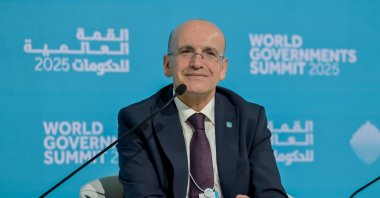 Treasury and Finance Minister Mehmet Şimşek attends a panel on the sidelines of the World Government Summit, Dubai, UAE, Feb. 12, 2025. (AA Photo)