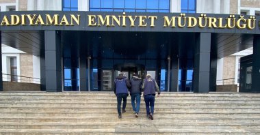 Police escort to the station a fugitive judge convicted of links to FETÖ, eastern Adıyaman province, Türkiye, Feb. 10, 2025. (AA Photo)