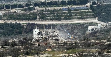 An excavator works on the Lebanese side of the border between Israel and Lebanon, as seen from Israel, Feb.17, 2025. (Reuters Photo)