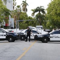 Police block roads leading in the South Beach neighborhood of Miami Beach, Florida, Oct. 31, 2017. (AP Photo)
