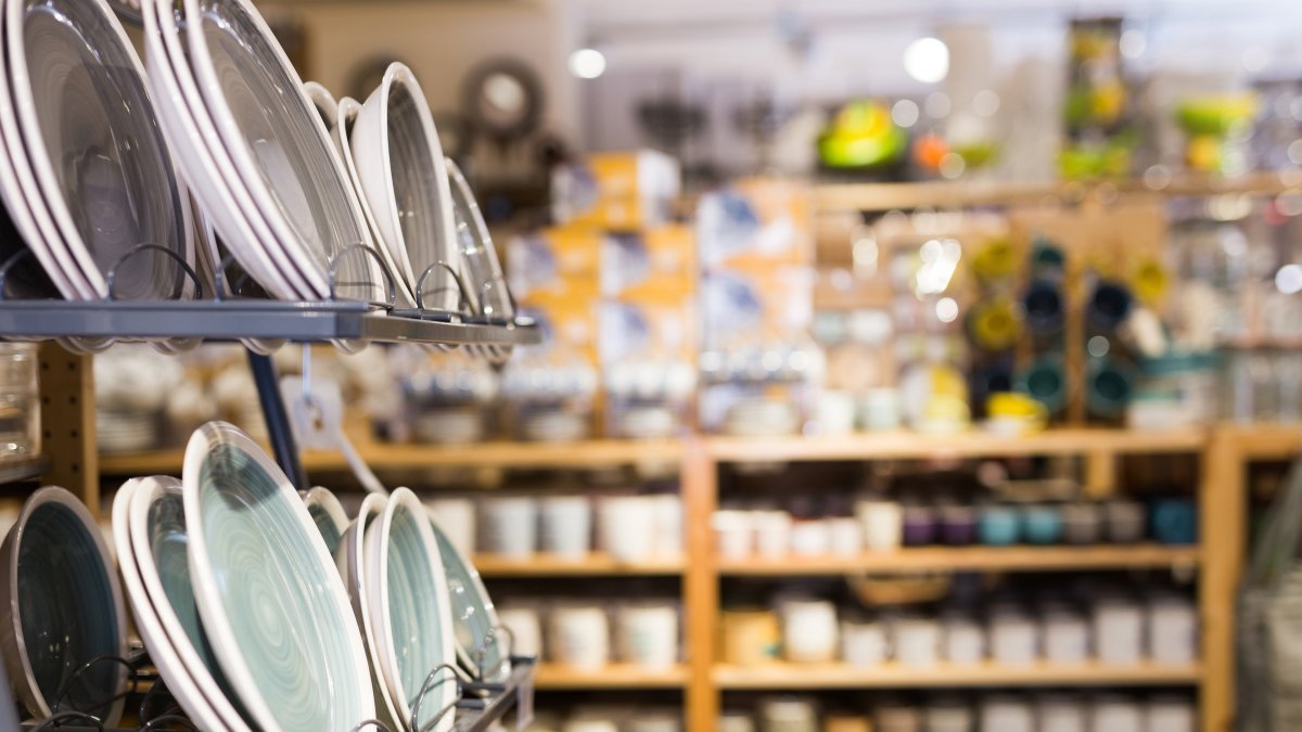 Closeup of various ceramic plates in the tableware department of a home furnishings store. (Shutterstock Photo)