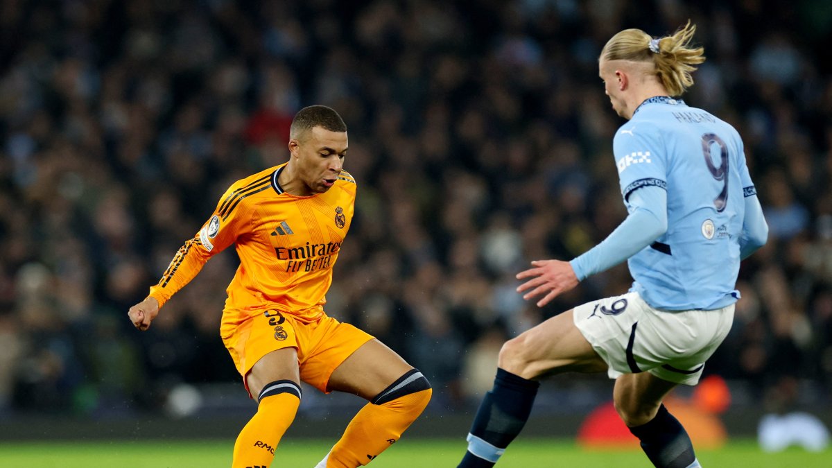 Real Madrid&#039;s Kylian Mbappe (L) in action with Manchester City&#039;s Erling Haaland during the Champions League knockout phase playoffs first leg match at the Etihad Stadium, Manchester, U.K., Feb. 11, 2025. (Reuters Photo)